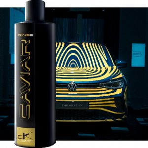 Bottle of Caviar Rinse quick spray wax in front of waxed car.