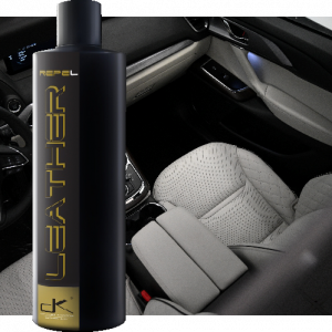 Bottle of Leather Repel in front of protected leather seats of car interior.