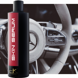 Skin Serum 16 ounce bottle in front of detailed car interior.