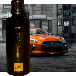 Bottle of Solid S2 in front of tuner car.